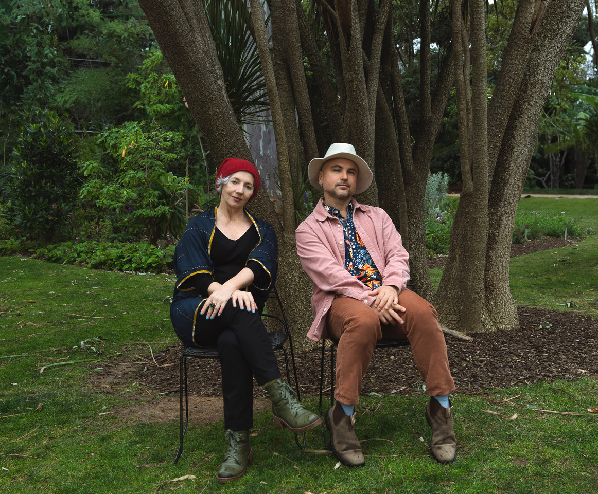 Plant Table artists sitting in a green setting